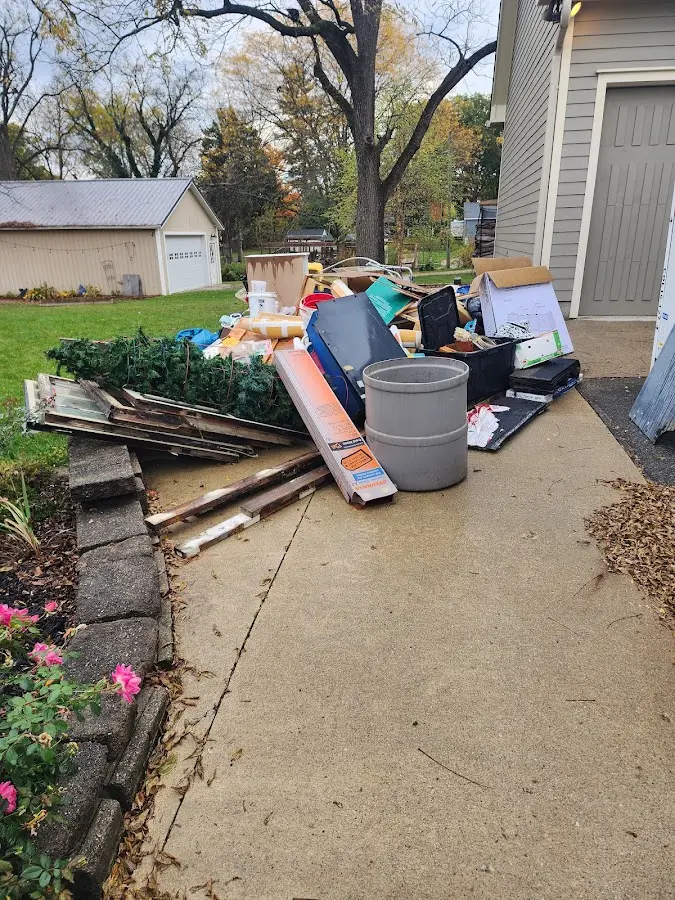 Dumpster being loaded with debris for Residential Dumpster Rental in Winnfield